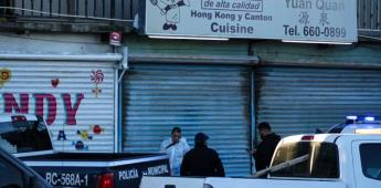 Encuentran cuerpo decapitado frente a estacionamiento de comida china